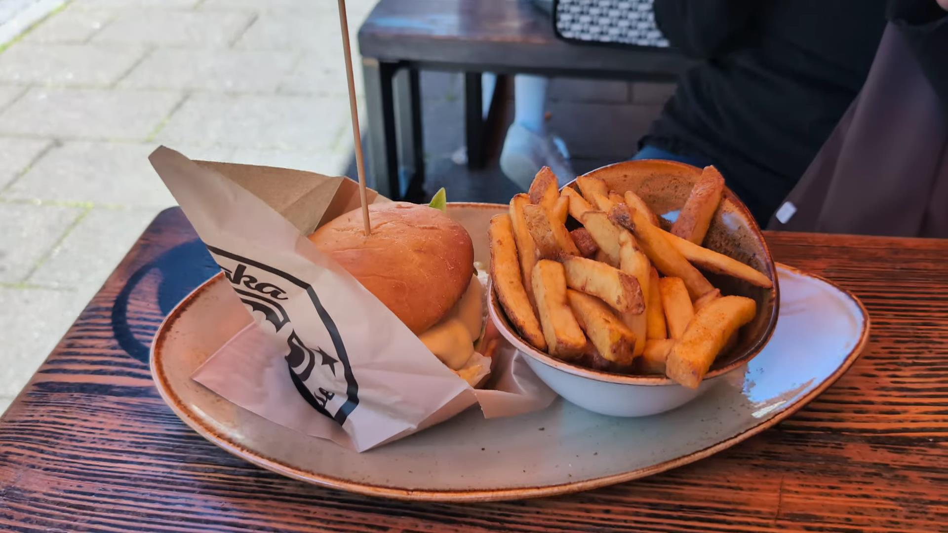 Juicy burger with crispy fries served for lunch at Shaka Burgerhouse in Garmisch-Partenkirchen, Germany.